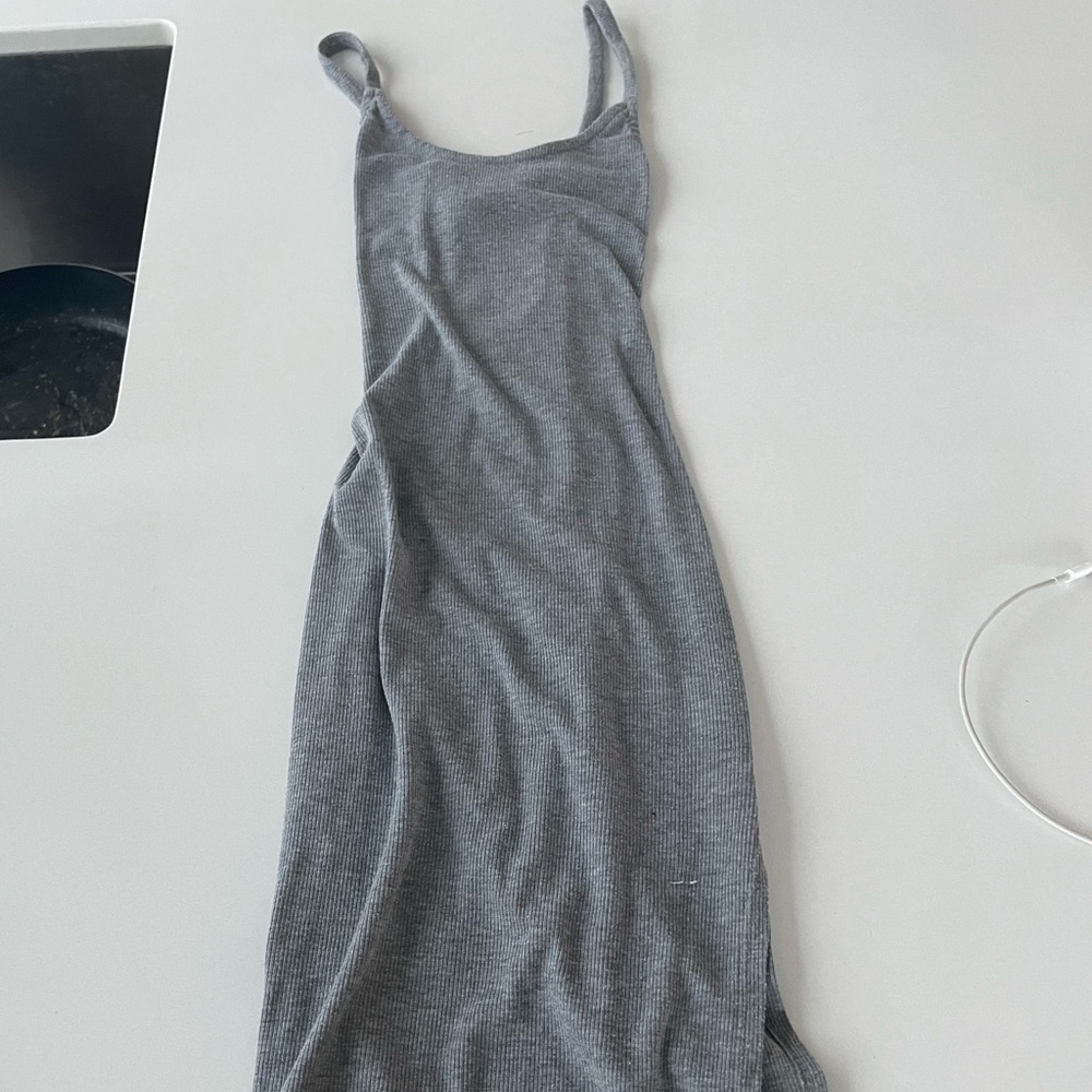 Cotton, ribbed fitted dress with split on the side. Size small.